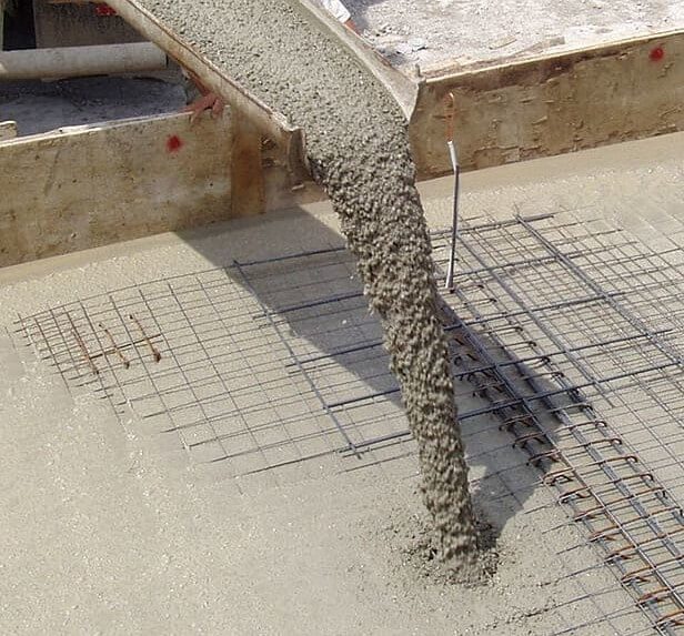 Ready mix concrete pouring from a cement mixer