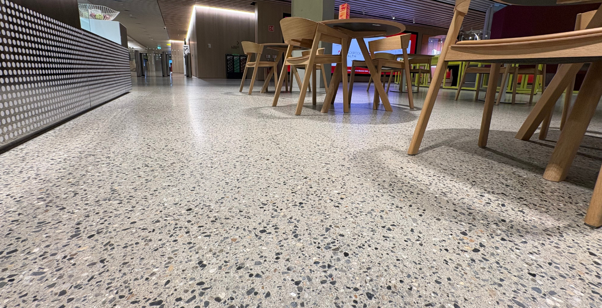 Polished exposed concrete aggregate floors in a chic and modern restaurant