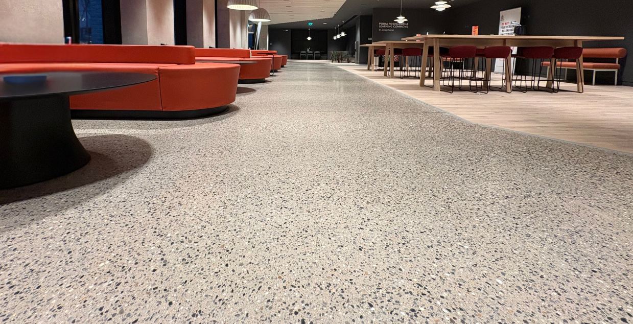 Polished exposed concrete aggregate floors in modern and cozy lobby