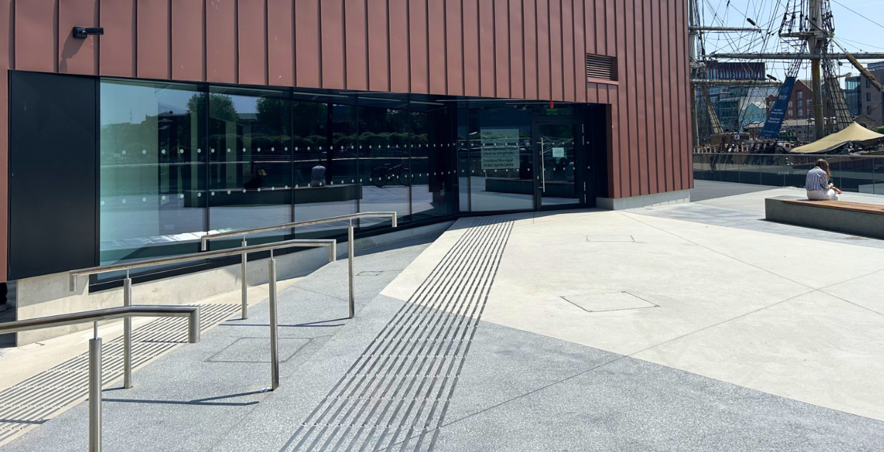 Black polished exposed concrete aggregate floors outside walkway for a busy tourist attraction